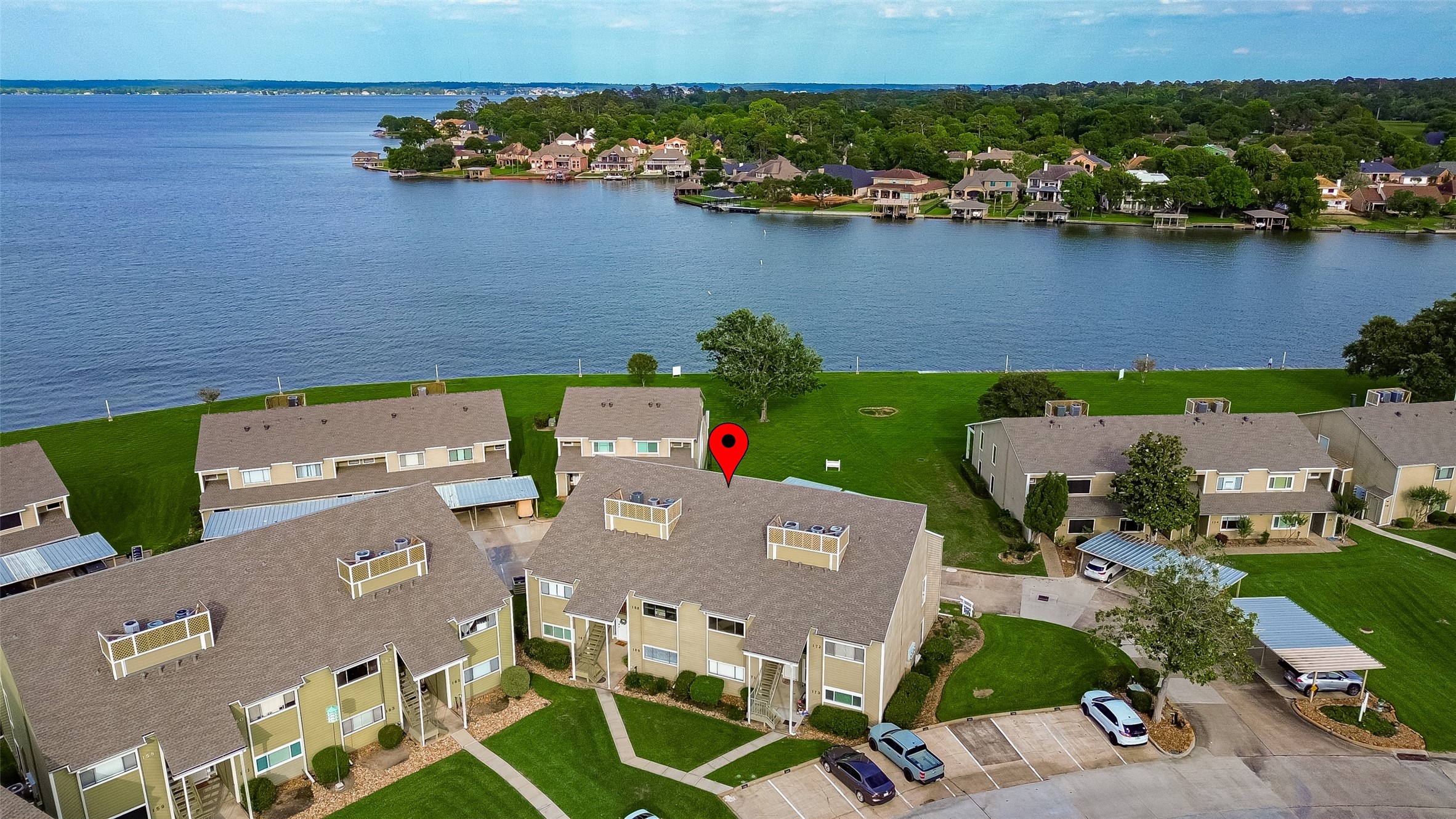 168 April Point Drive South, Unit 168 Conroe, TX 77356 - Photo 37 of 39 an aerial view of a house with a lake view