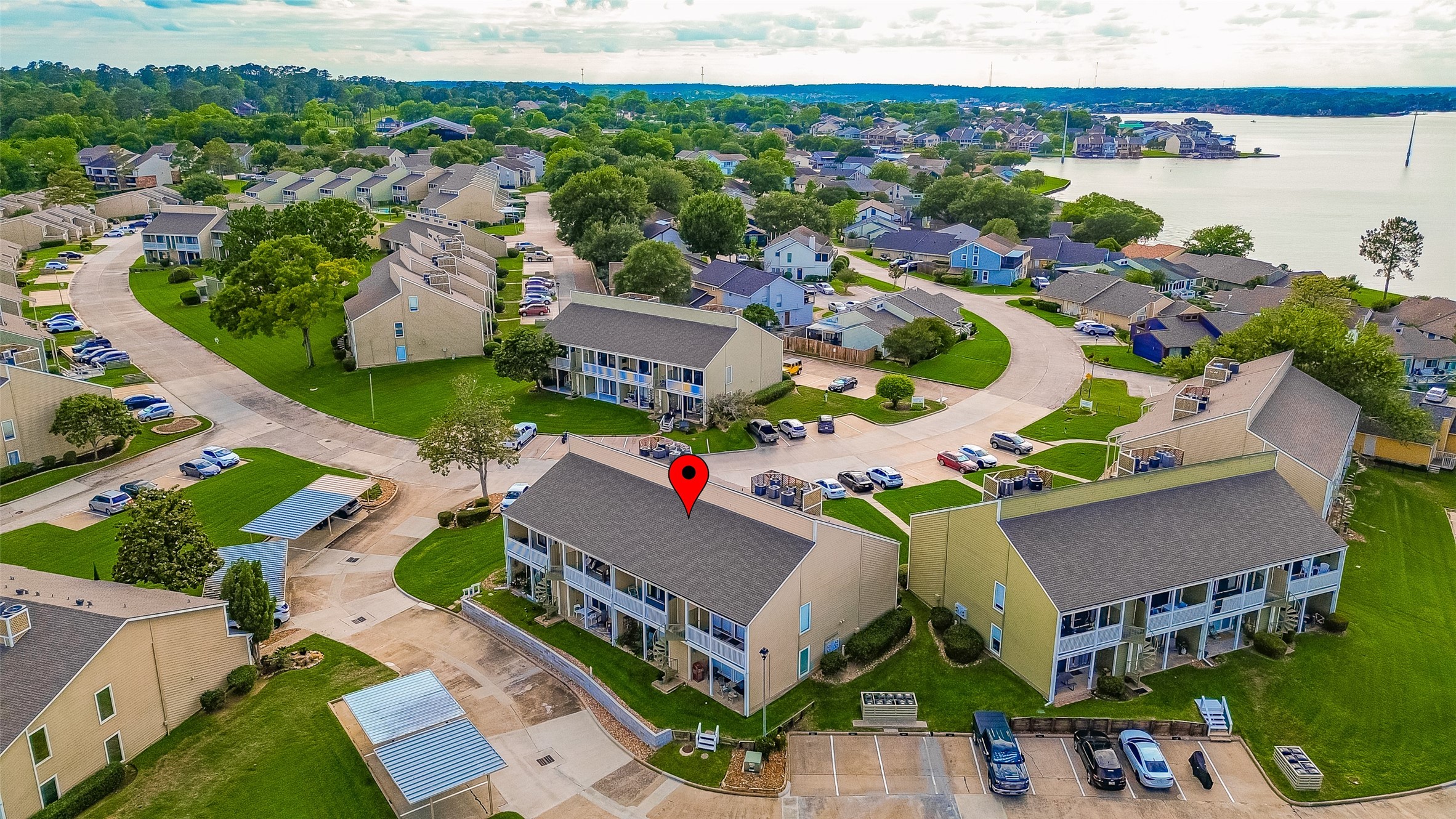 168 April Point Drive South, Unit 168 Conroe, TX 77356 - Photo 38 of 39 an aerial view of a house with a swimming pool