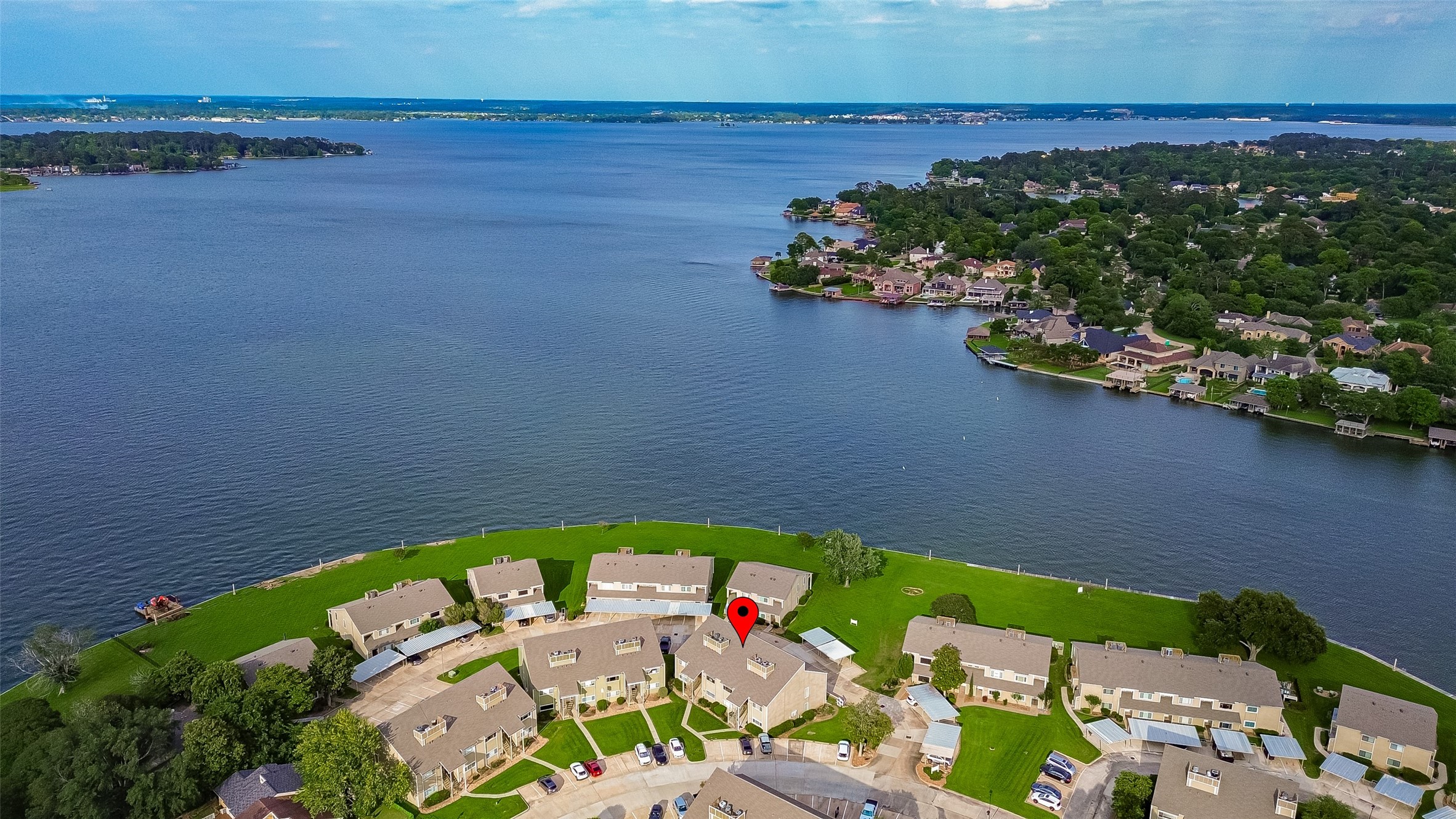 168 April Point Drive South, Unit 168 Conroe, TX 77356 - Photo 39 of 39 an aerial view of a house with a lake view