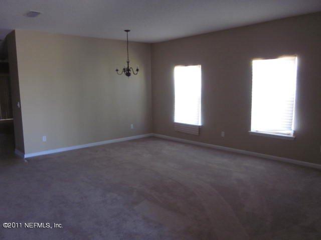 7284 Rampart Ridge Circle West Jacksonville, FL 32244 - Photo 2 of 9 an empty room that has a window