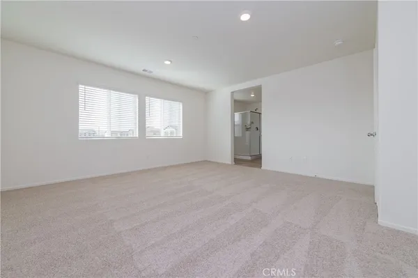 a kitchen with a sink and a toilet