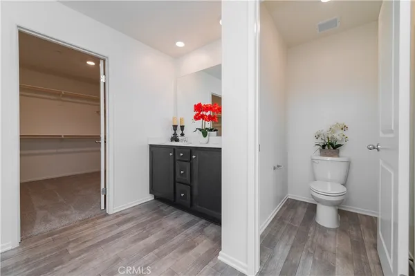 a bathroom with a sink vanity and a mirror