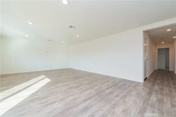 a view of a kitchen cabinets and wooden floor