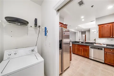 a kitchen with a sink and a stove top oven