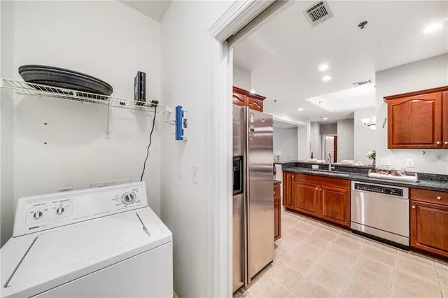 a kitchen with a sink and a stove top oven