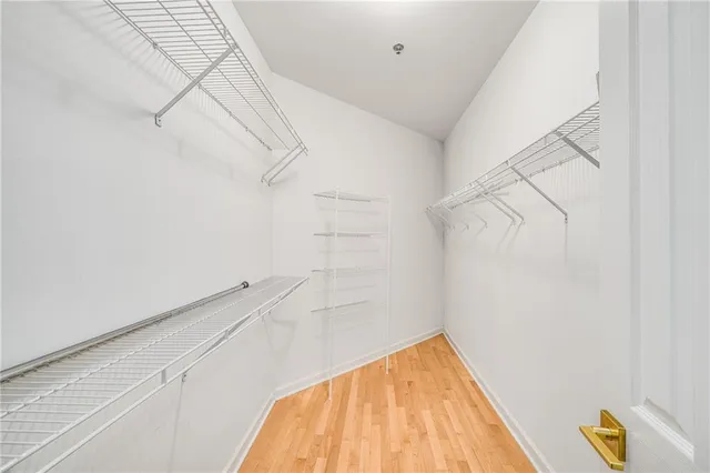 a bathroom with double vanity sinks and a mirror