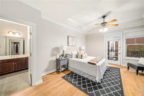 a bedroom that has a bed and chair