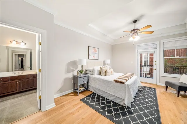 a bedroom that has a bed and chair