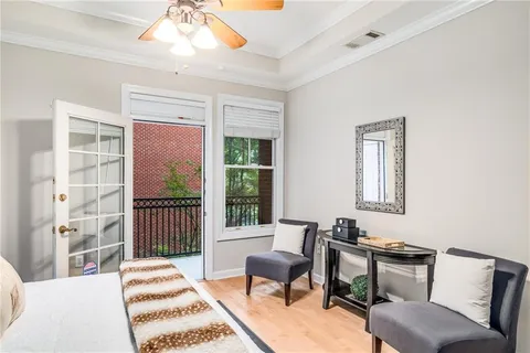 a view of a balcony with a small yard