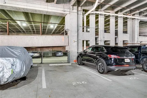 a view of furniture and refrigerator in a room