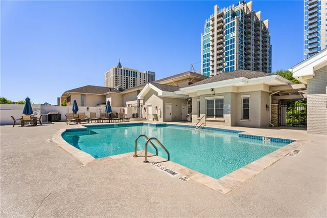 a view of a brick building next to a road