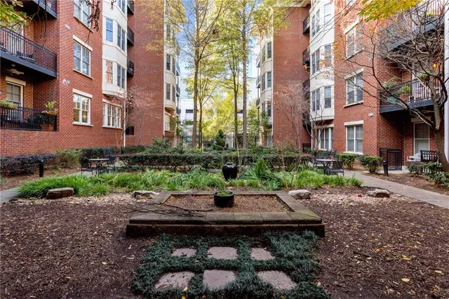 an aerial view of a house with garden space and street view