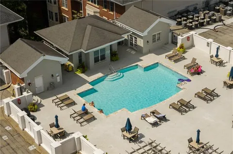 a view of a patio with swimming pool