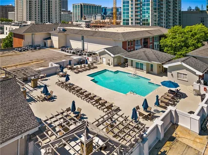 an aerial view of a house with a yard and lake view
