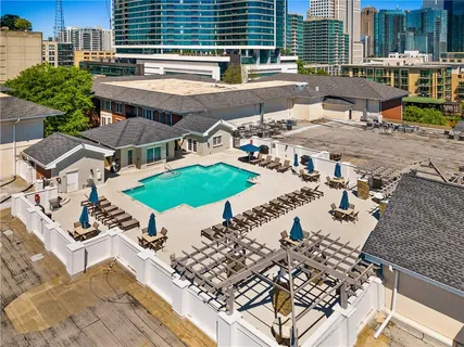 an aerial view of multiple houses with yard
