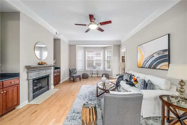 a living room with furniture fireplace and flat screen tv