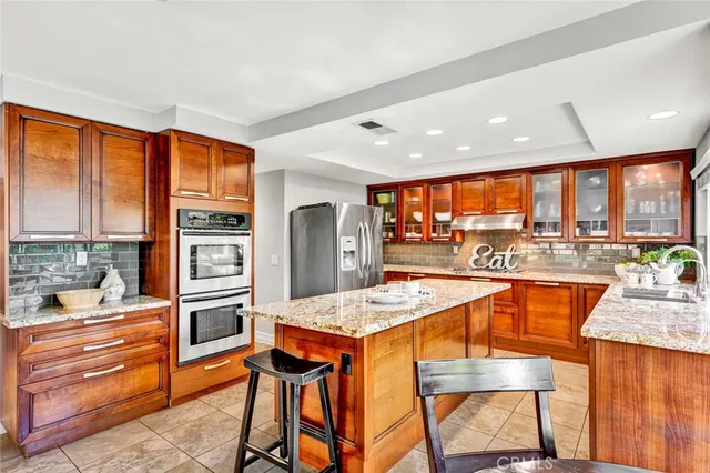 a large kitchen with a table and chairs