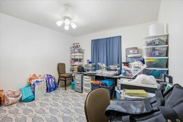 a workspace with furniture and a book shelf