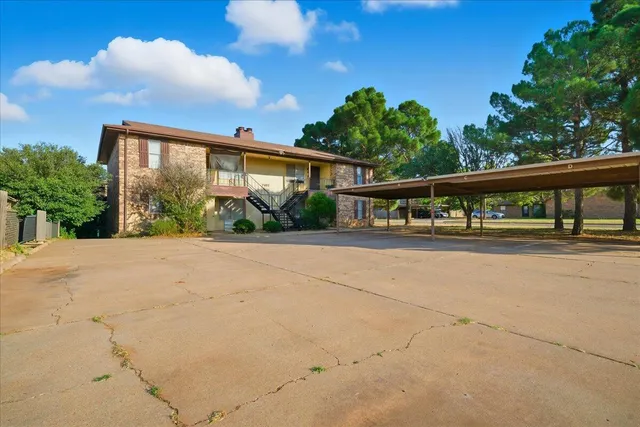 a view of house with yard