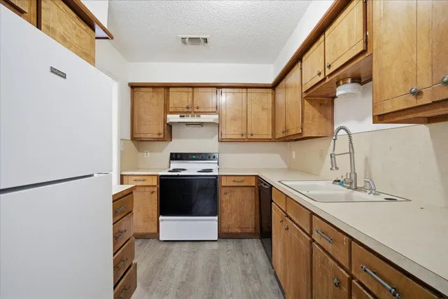 a kitchen with a stove and a sink