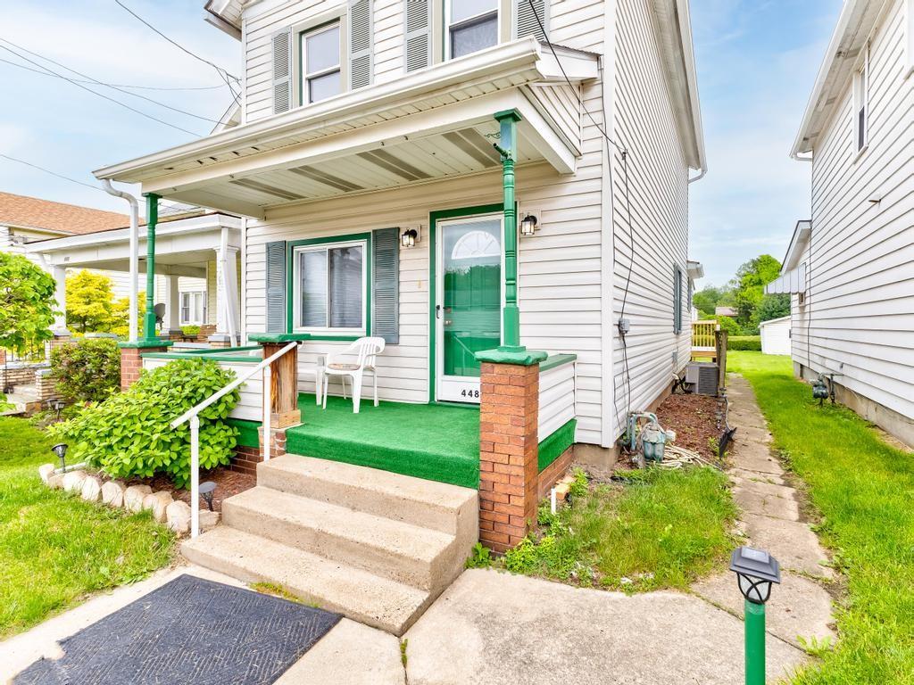 448 Park Street Rochester, PA 15074 - Photo 2 of 29 a front view of a house with a yard porch and outdoor seating