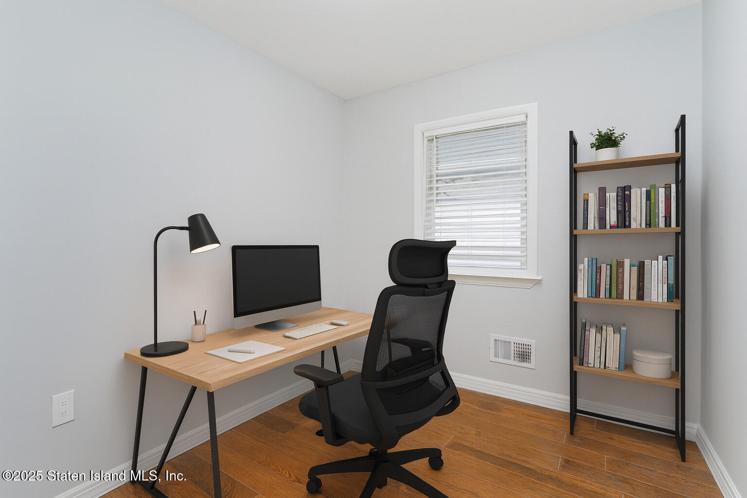 13 Laforge Avenue Staten Island, NY 10302 - Photo 11 of 31 a view of a workspace with furniture and a book shelf