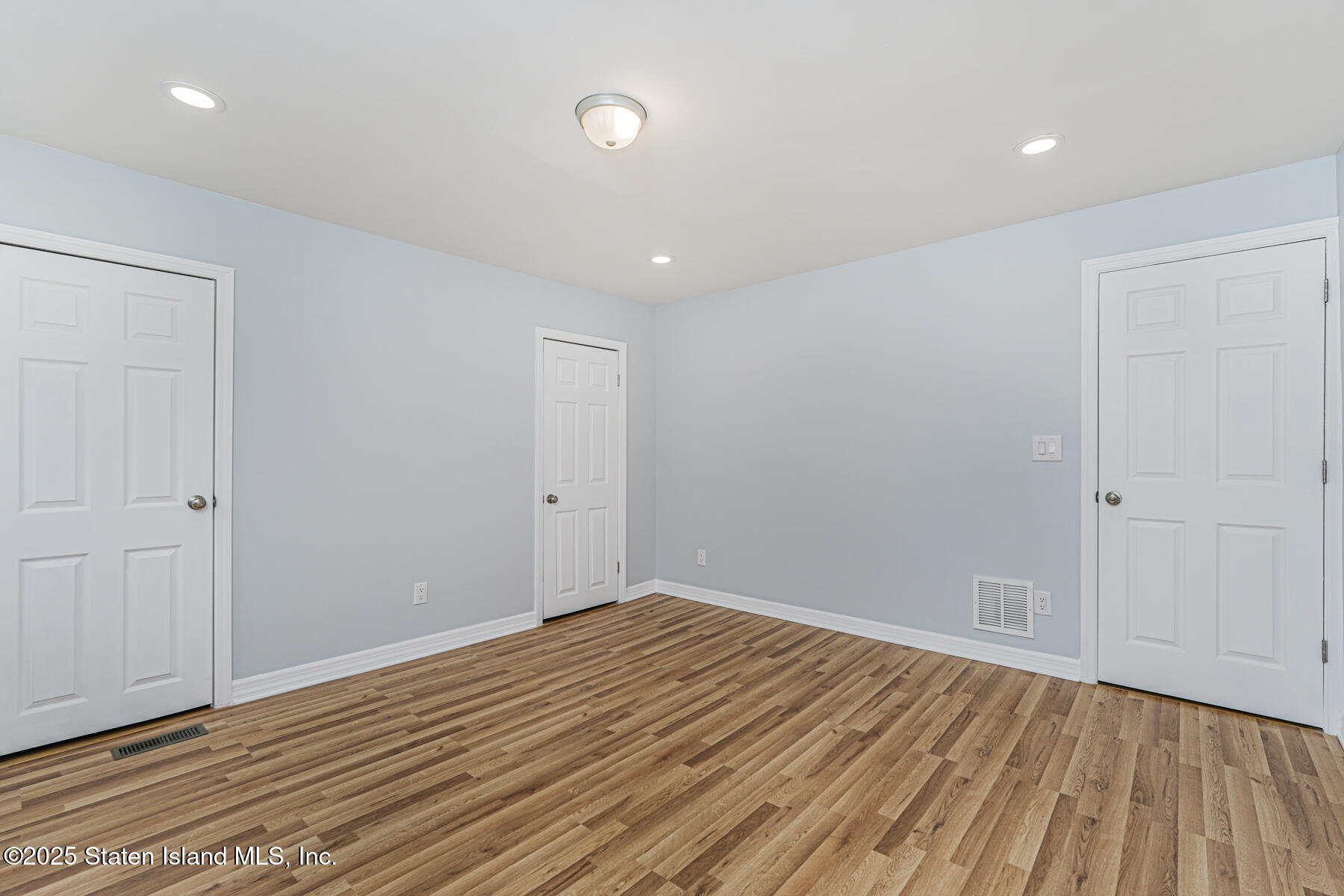 13 Laforge Avenue Staten Island, NY 10302 - Photo 19 of 31 a view of room with wooden floor and entryway