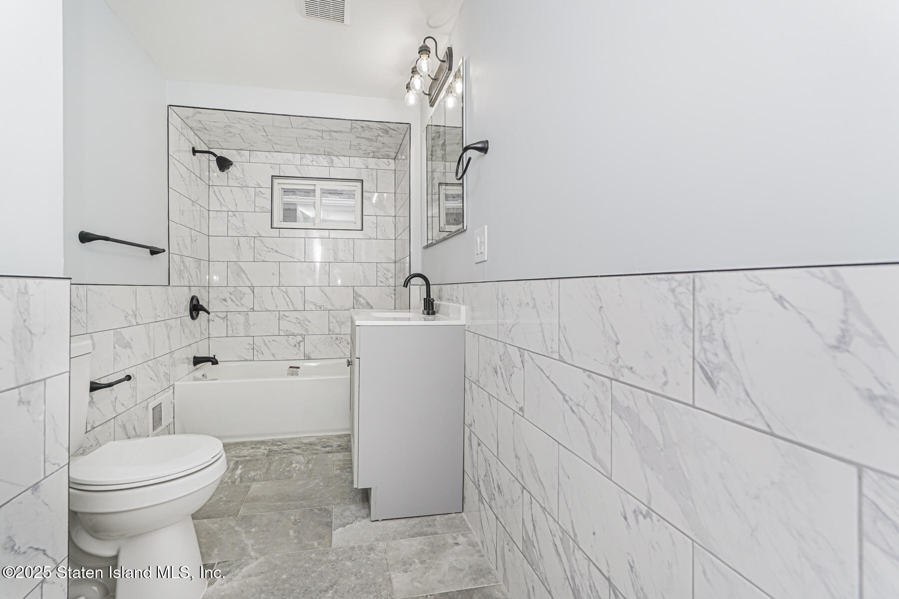 13 Laforge Avenue Staten Island, NY 10302 - Photo 23 of 31 a bathroom with a toilet sink and shower