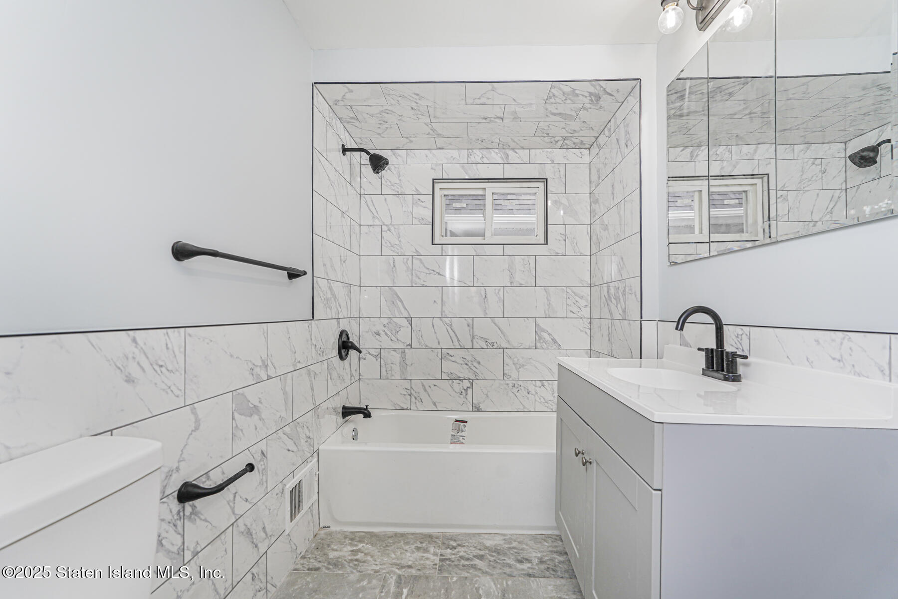 13 Laforge Avenue Staten Island, NY 10302 - Photo 24 of 31 a bathroom with a bathtub and shower