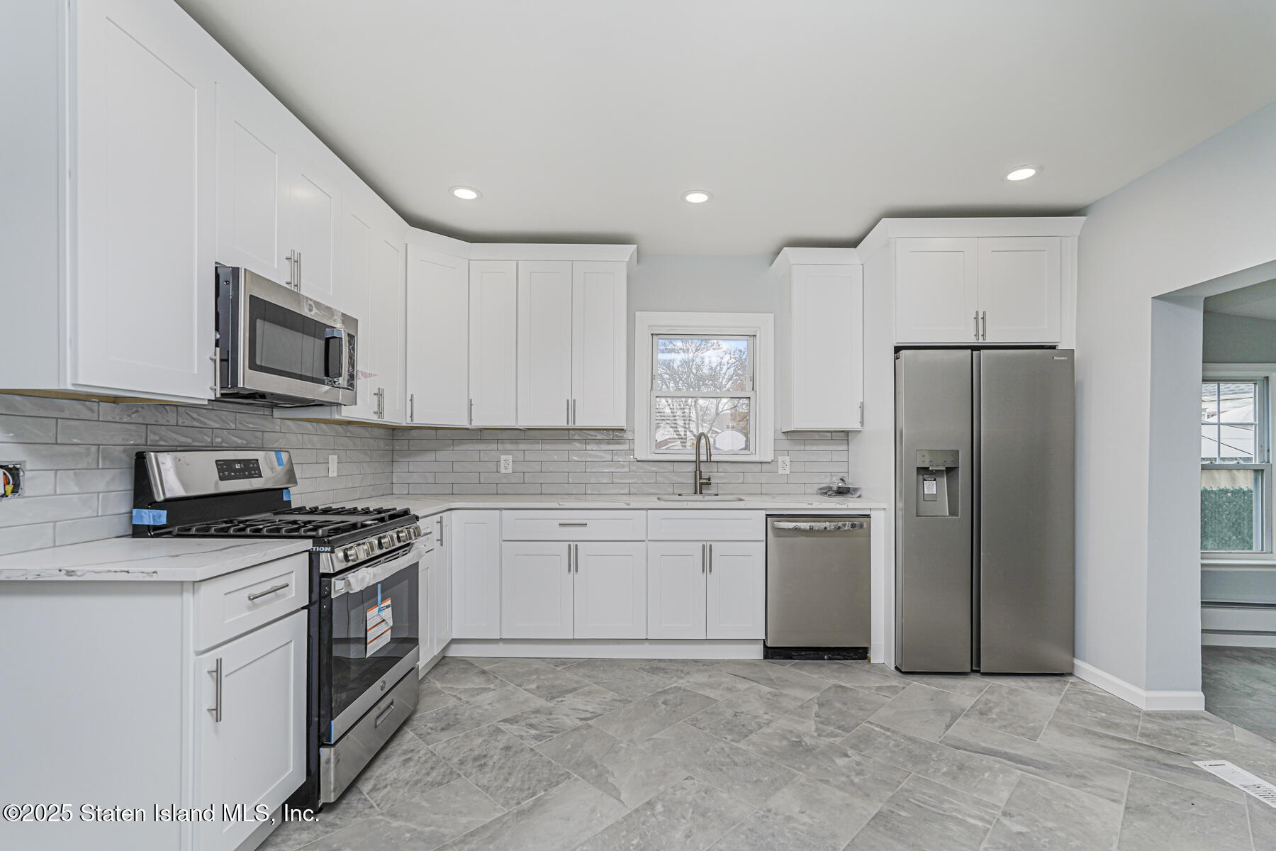 13 Laforge Avenue Staten Island, NY 10302 - Photo 6 of 31 a kitchen with a sink stove and refrigerator