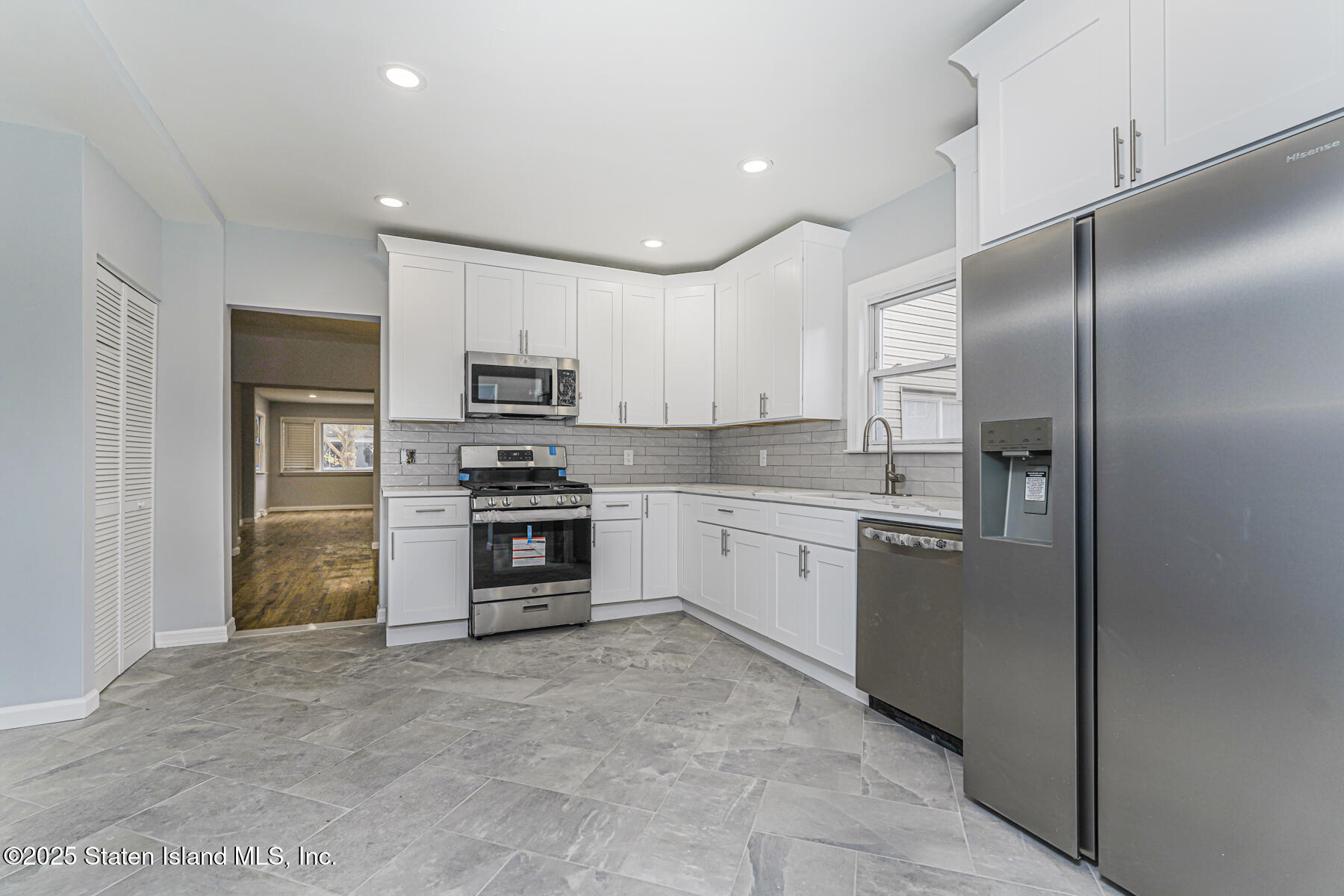 13 Laforge Avenue Staten Island, NY 10302 - Photo 8 of 31 a kitchen with stainless steel appliances granite countertop a refrigerator and a stove