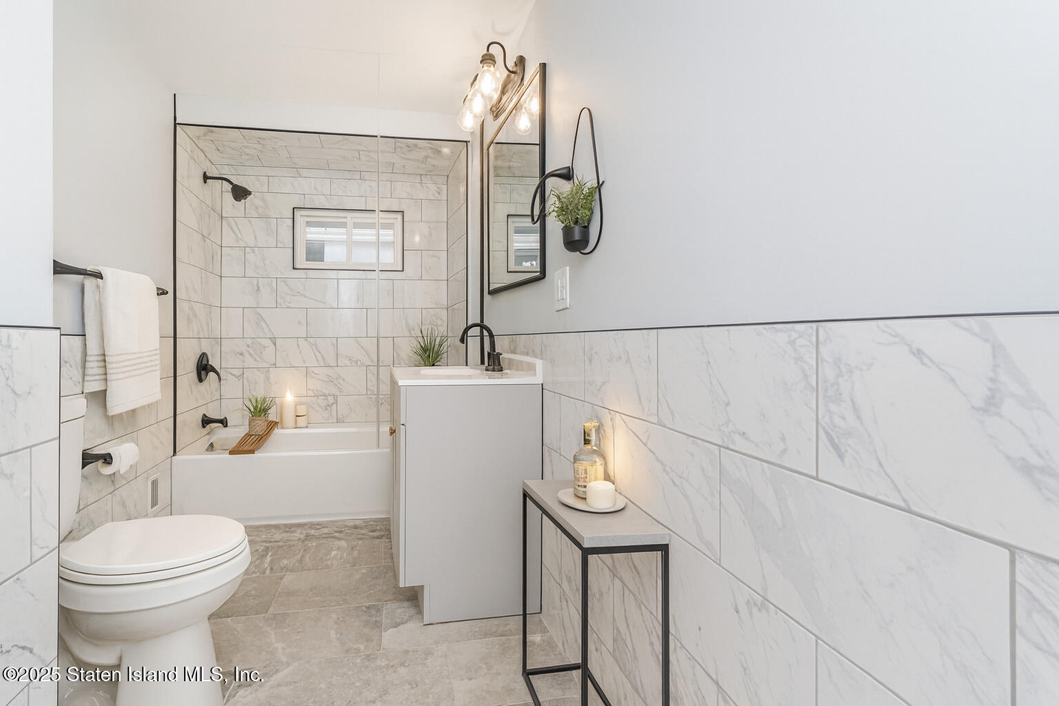 13 Laforge Avenue Staten Island, NY 10302 - Photo 10 of 31 a bathroom with a toilet sink and shower