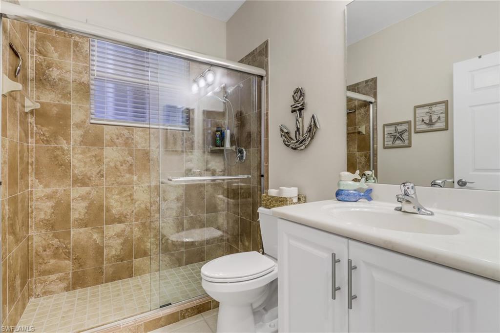 9146 Springview Loop Estero, FL 33928 - Photo 20 of 49 a bathroom with a sink toilet and shower