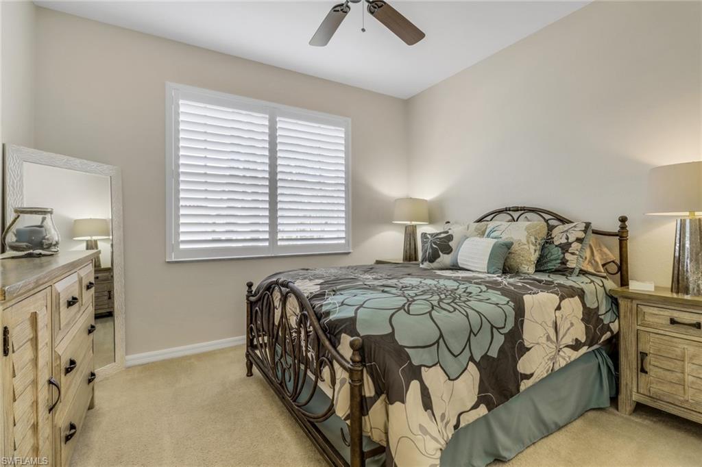 9146 Springview Loop Estero, FL 33928 - Photo 21 of 49 a bedroom with double bed and a window