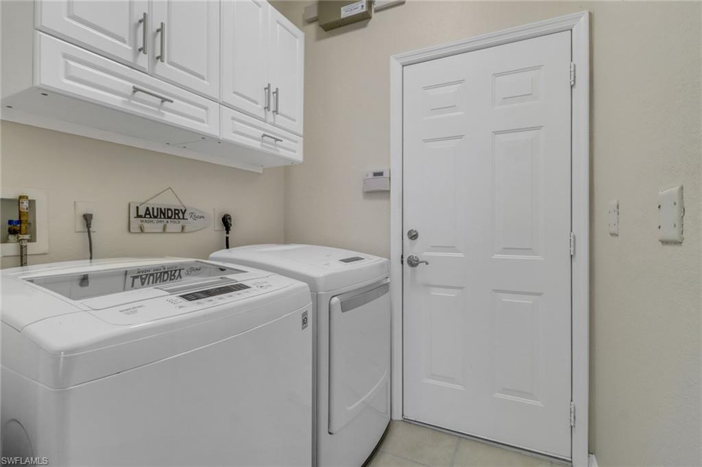 9146 Springview Loop Estero, FL 33928 - Photo 22 of 49 a utility room with dryer and washer