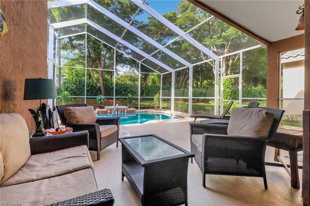 9146 Springview Loop Estero, FL 33928 - Photo 23 of 49 a patio with patio couch and a potted plant