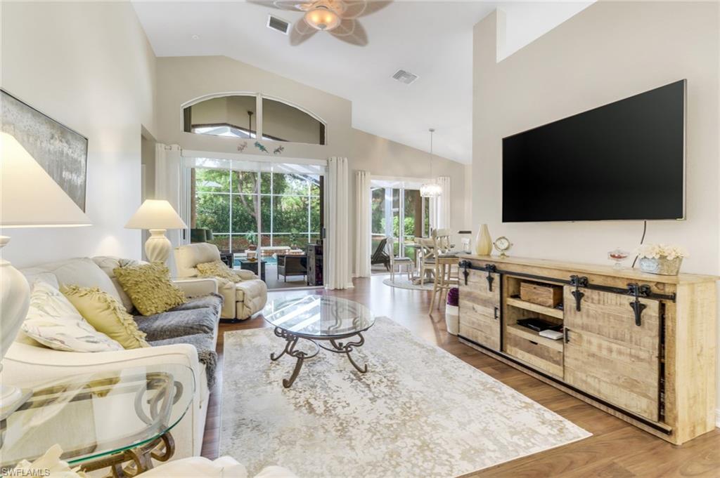 9146 Springview Loop Estero, FL 33928 - Photo 6 of 49 a living room with furniture and a flat screen tv