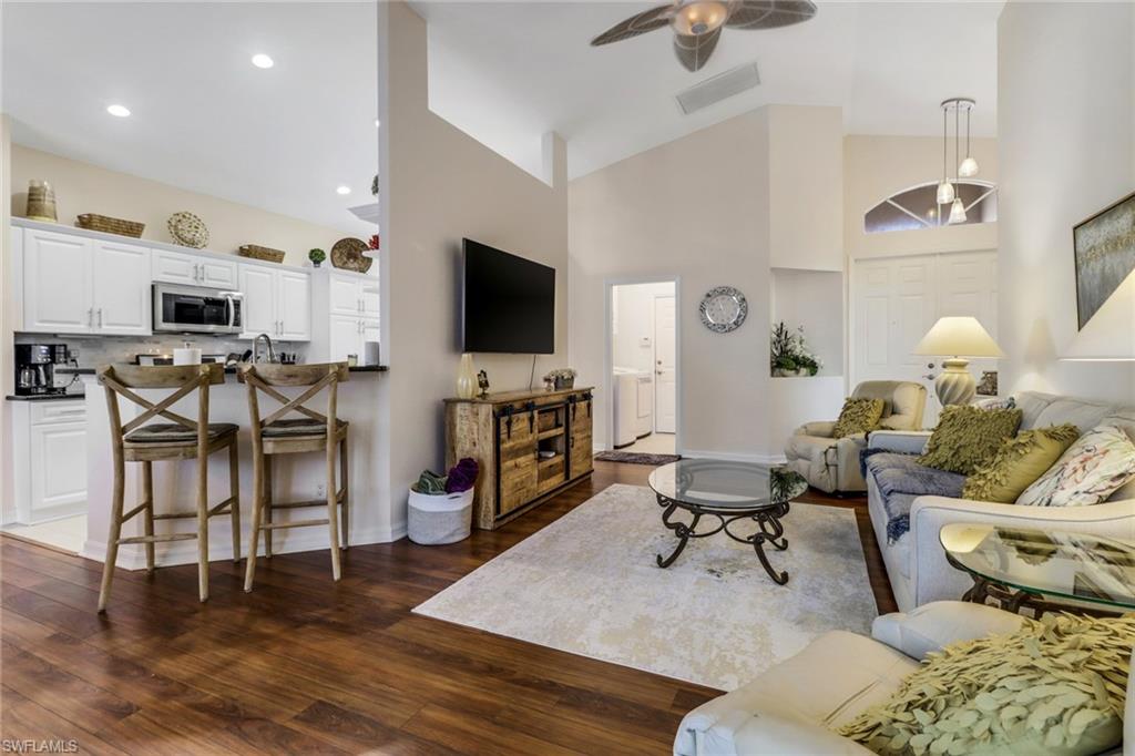 9146 Springview Loop Estero, FL 33928 - Photo 8 of 49 a living room with furniture and a flat screen tv