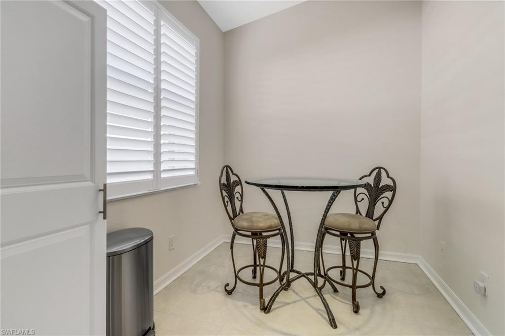 9146 Springview Loop Estero, FL 33928 - Photo 9 of 49 a table and chairs in a room
