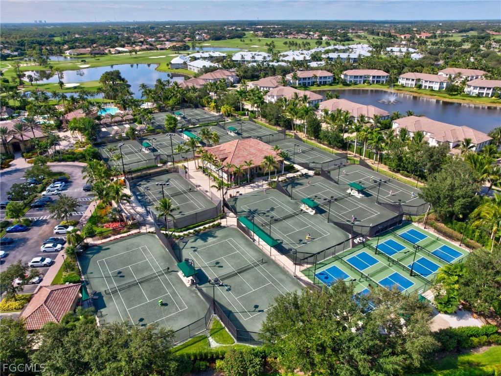 6422 Legacy Circle, Unit 704 Naples, FL 34113 - Photo 42 of 49 an aerial view of residential building with outdoor space