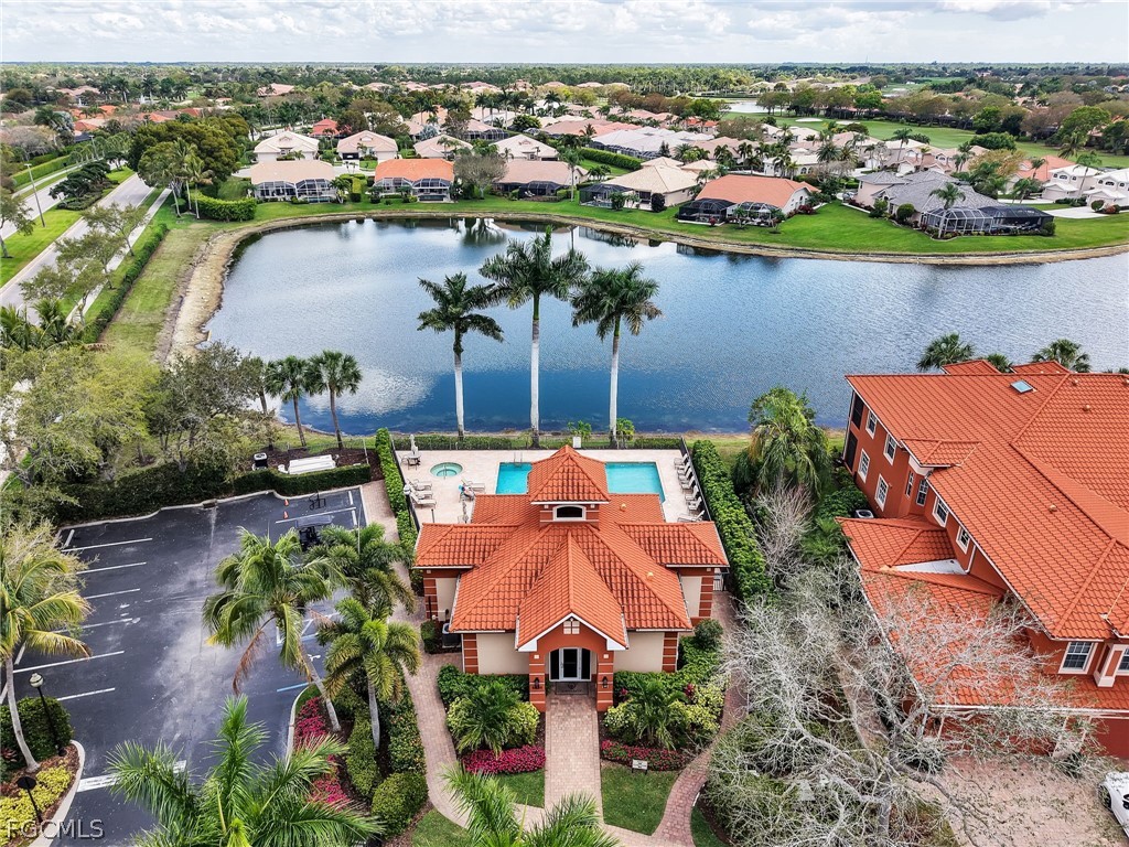 6422 Legacy Circle, Unit 704 Naples, FL 34113 - Photo 46 of 49 an aerial view of a house with a lake view