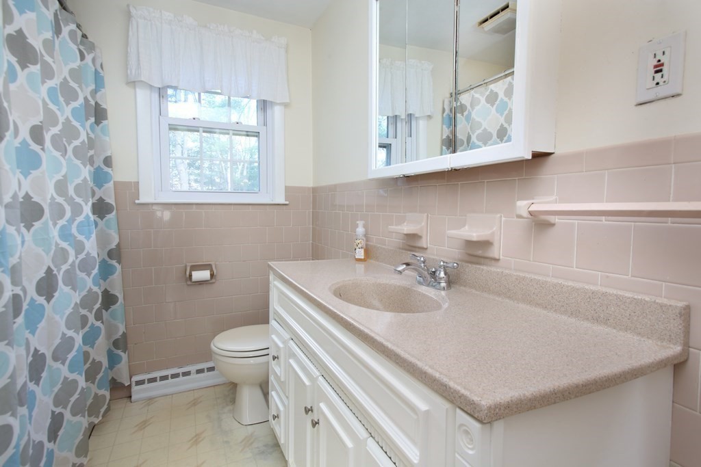 36 Donnell Road Walpole, MA 02032 - Photo 10 of 20 a bathroom with a sink a toilet and a window