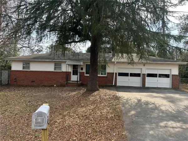 front view of a house with a trees