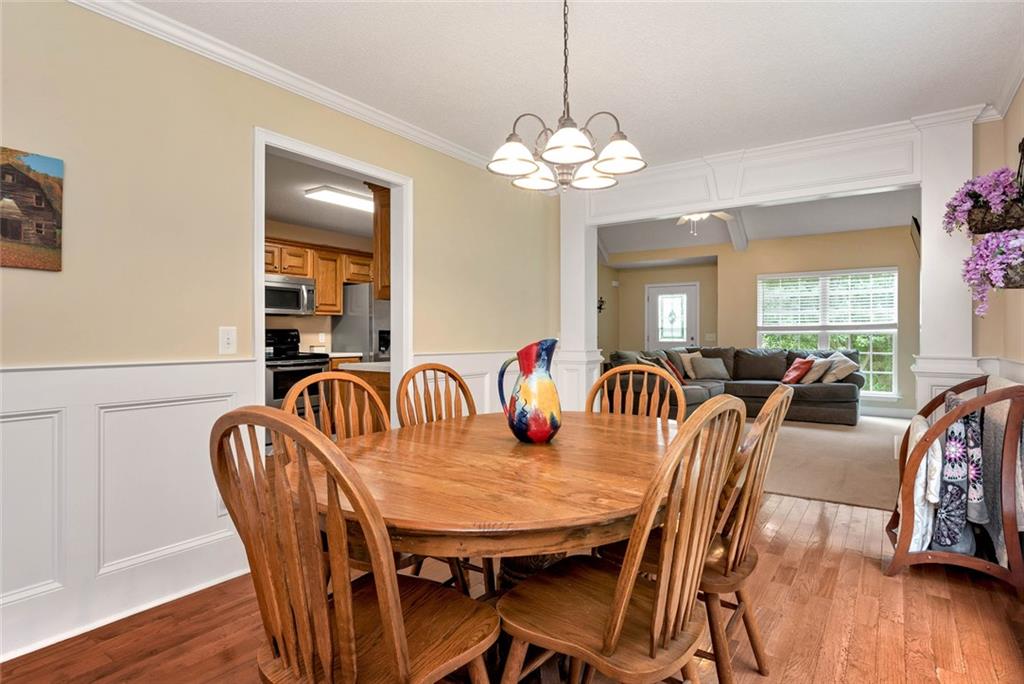 1044 Lothridge Road Cleveland, GA 30528 - Photo 17 of 40 a view of a a dining room with furniture window and wooden floor