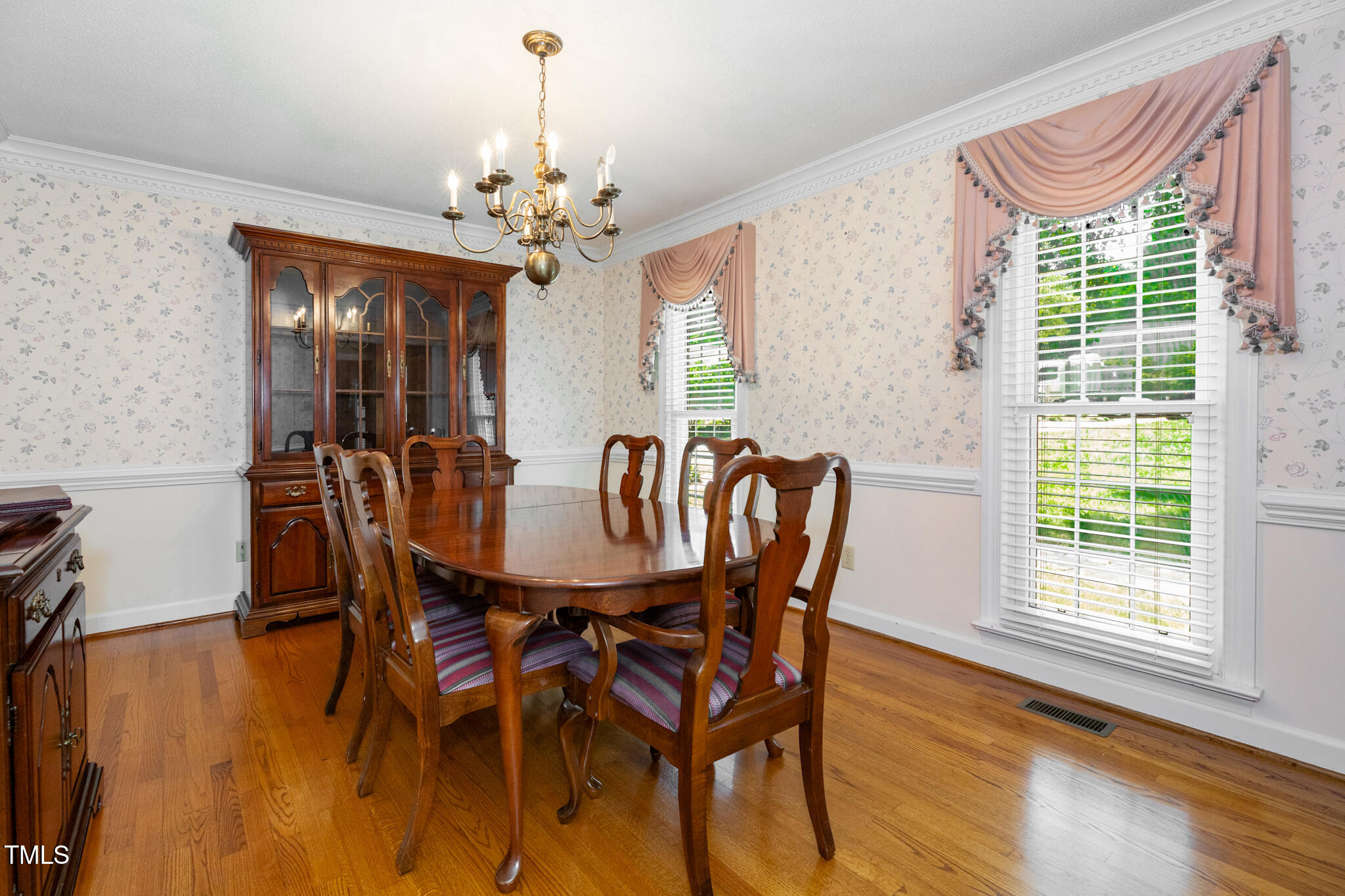 6904 Aspen Court Raleigh, NC 27615 - Photo 10 of 51 a view of a dining room with furniture window and wooden floor