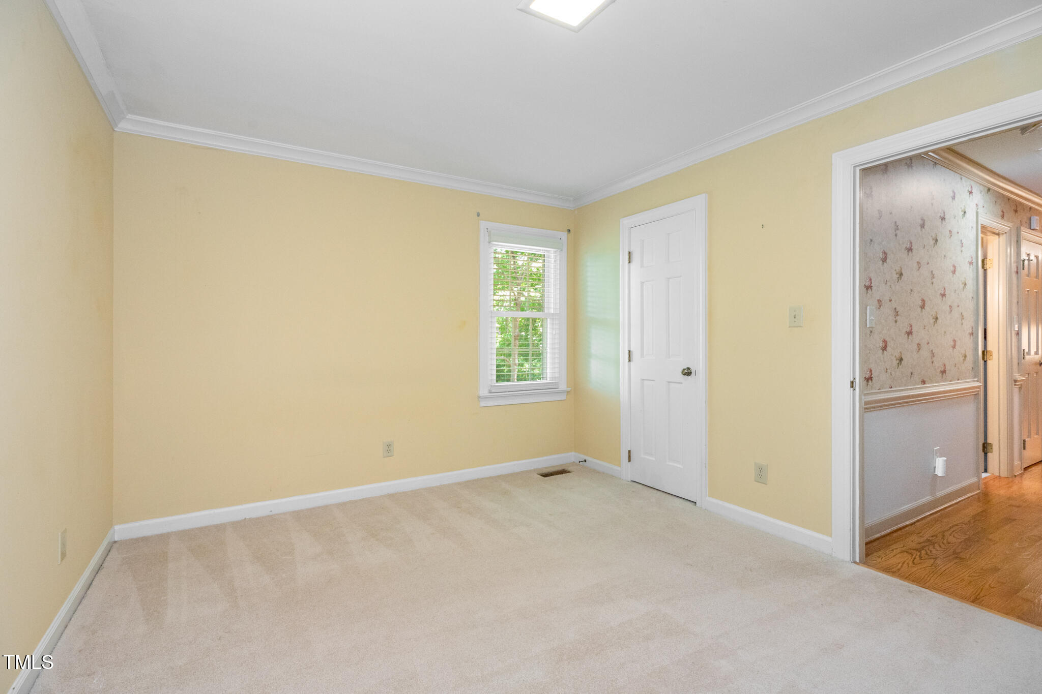 6904 Aspen Court Raleigh, NC 27615 - Photo 12 of 51 an empty room with windows