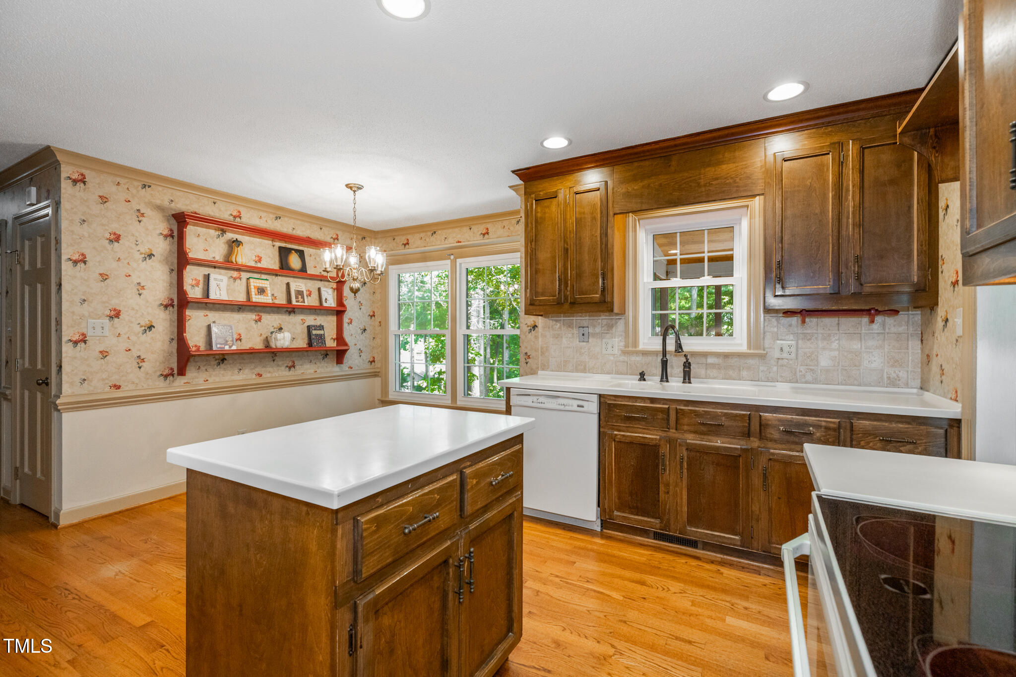 6904 Aspen Court Raleigh, NC 27615 - Photo 18 of 51 a kitchen with a stove a sink and a refrigerator