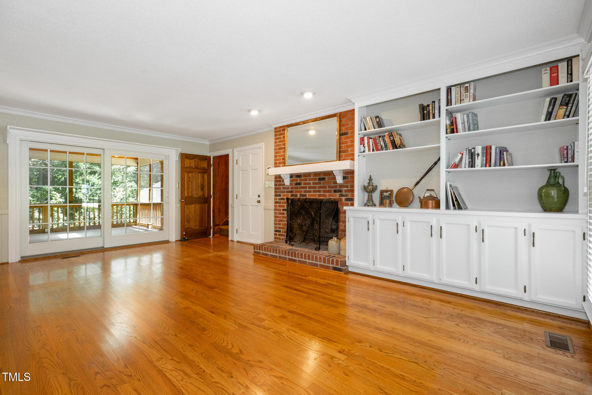6904 Aspen Court Raleigh, NC 27615 - Photo 24 of 51 a view of an empty room with a window and wooden floor