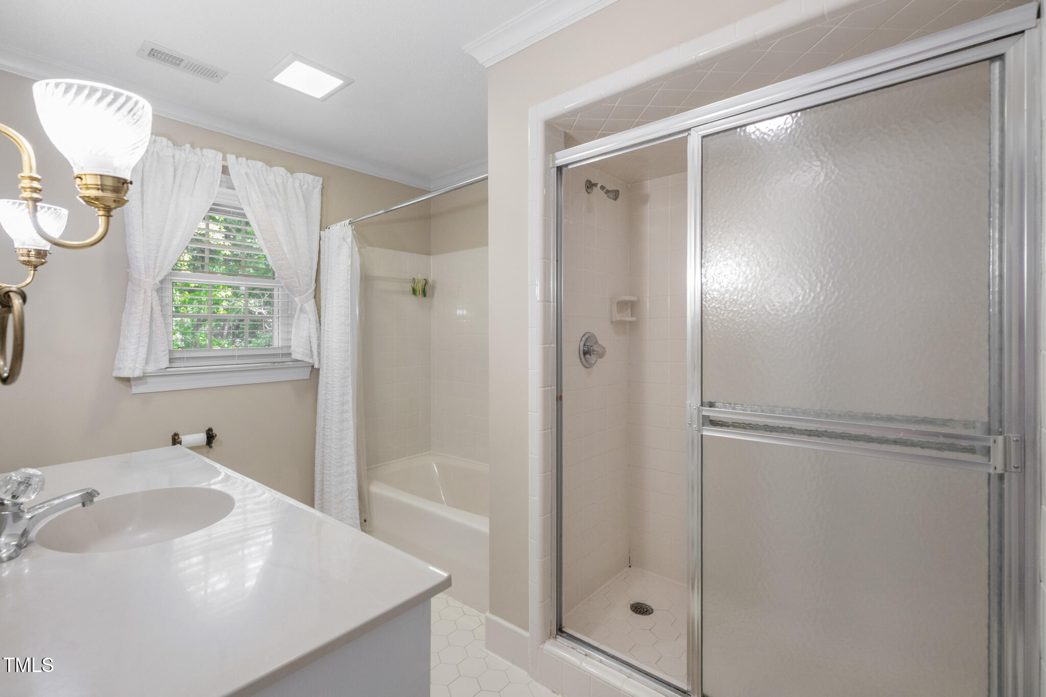 6904 Aspen Court Raleigh, NC 27615 - Photo 34 of 51 a bathroom with a bathtub and a sink