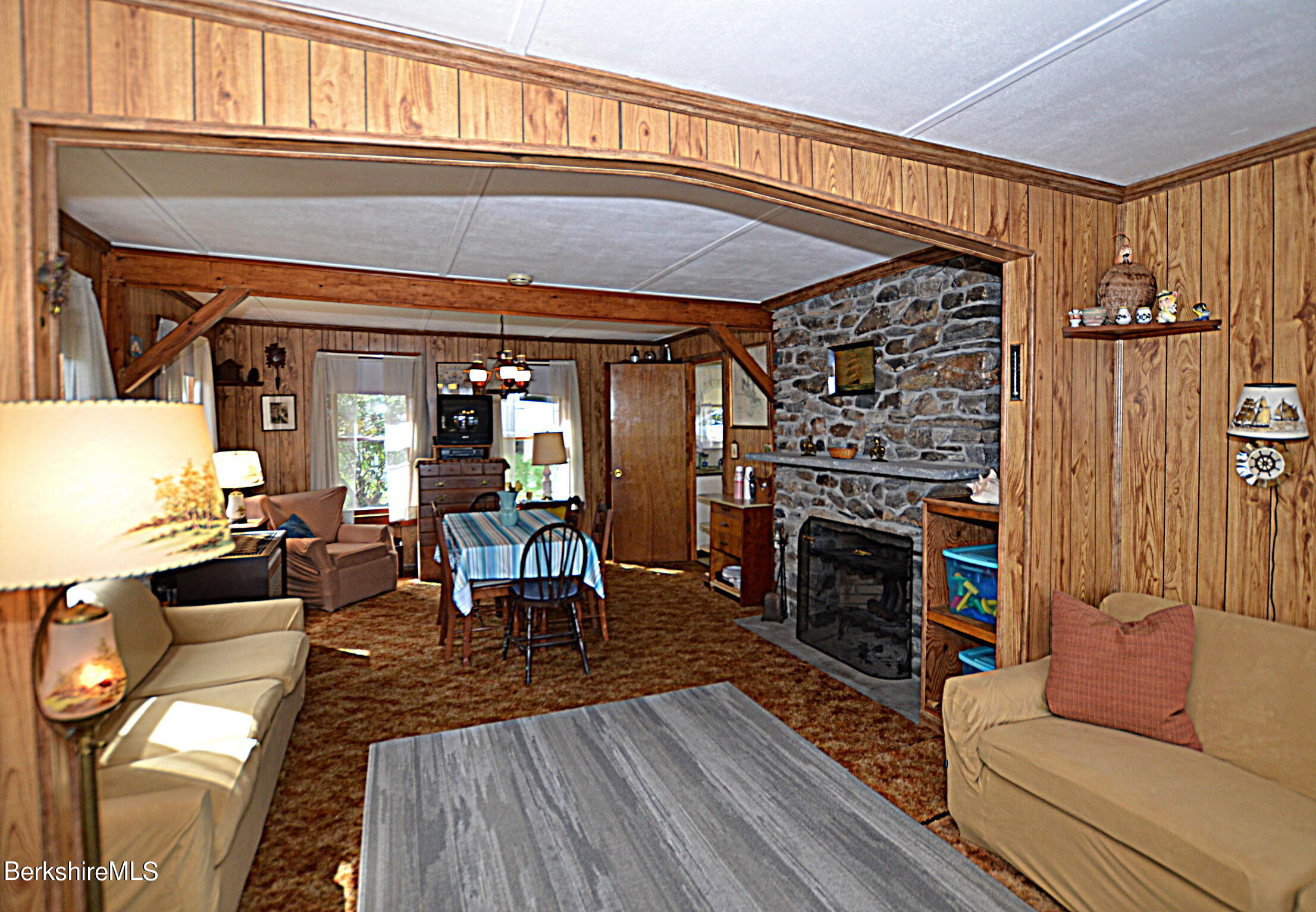 71 Flint Farm Road Otis, MA 01029 - Photo 12 of 21 a living room with furniture and a fireplace